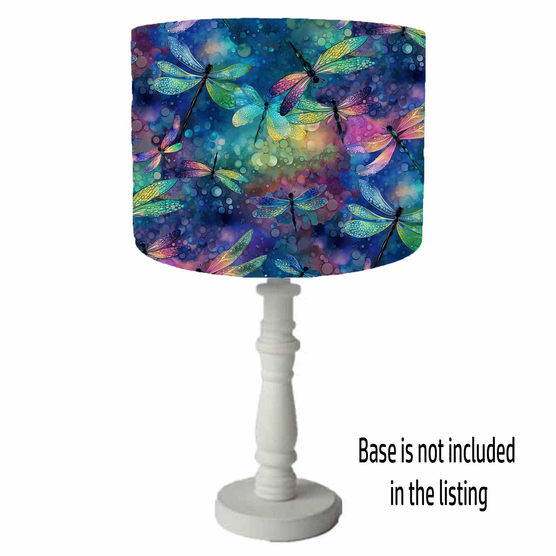 an iridescent effect drum lampshade depicting bold dragonflies on a blue, green and pink background. Table lamp shade view