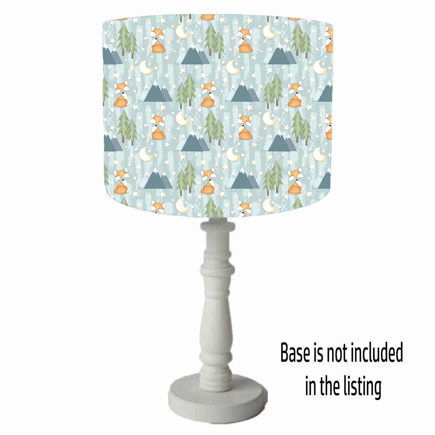 Lamp with a patterned shade featuring foxes, trees, and mountains on a white background. Table Lamp view