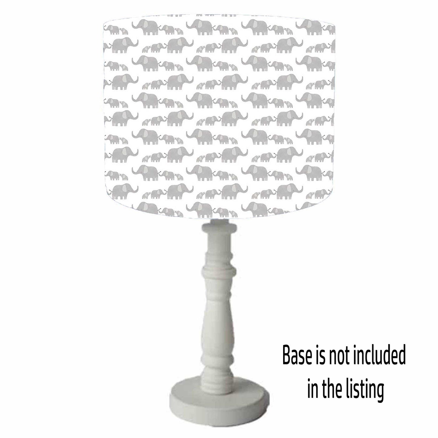 Safari themed drum lampshade with parent and baby elephant in grey on a white background. Table lamp view