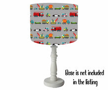 Load image into Gallery viewer, vehicle themed table lamp shade with different types of transportation set on a grey background. cute children lampshade
