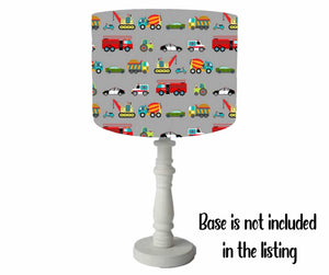 vehicle themed table lamp shade with different types of transportation set on a grey background. cute children lampshade