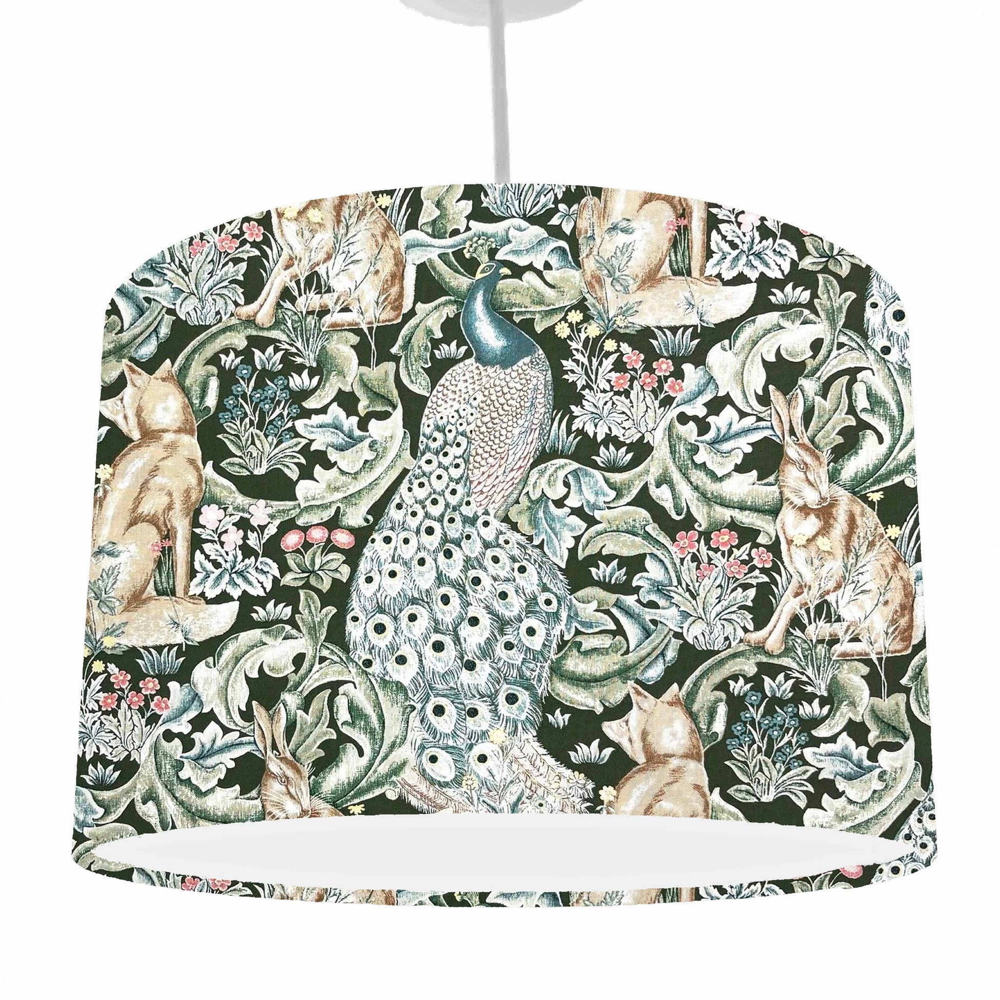 Drum lampshade with nature-themed design featuring animals and foliage on a green background