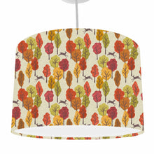 Load image into Gallery viewer, autumn trees in oranges, reds and greens set on a natural coloured background with silhouettes of deers ceiling light shade
