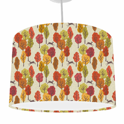 autumn trees in oranges, reds and greens set on a natural coloured background with silhouettes of deers ceiling light shade