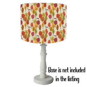 drum table lampshade with colourful autumn trees and deer silhouette set on a natural coloured background