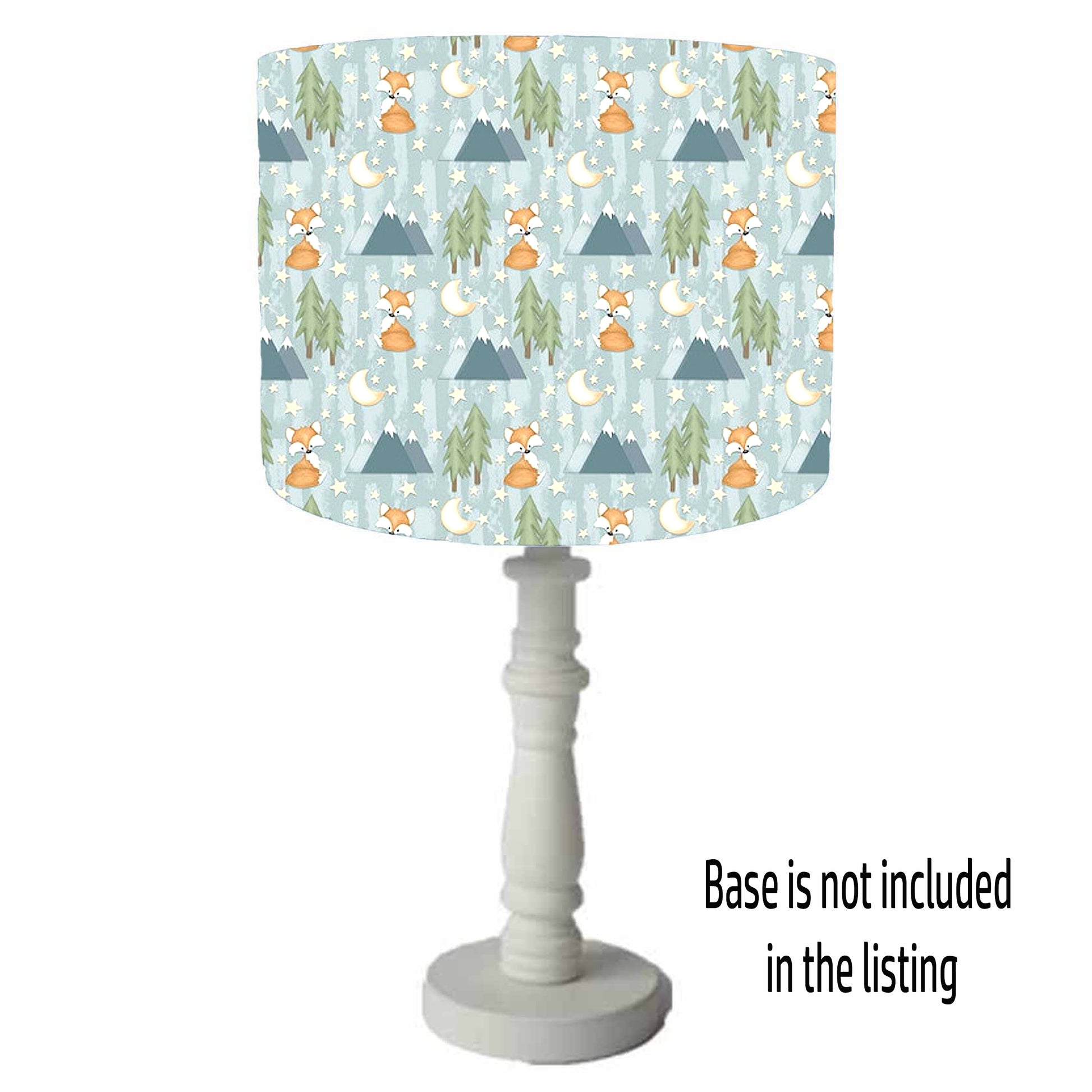 Lamp with a patterned shade featuring foxes, trees, and mountains on a white background. Table Lamp view