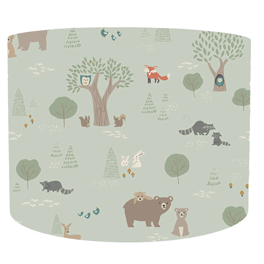 Forest animal patterned drum lampshade on a light green background