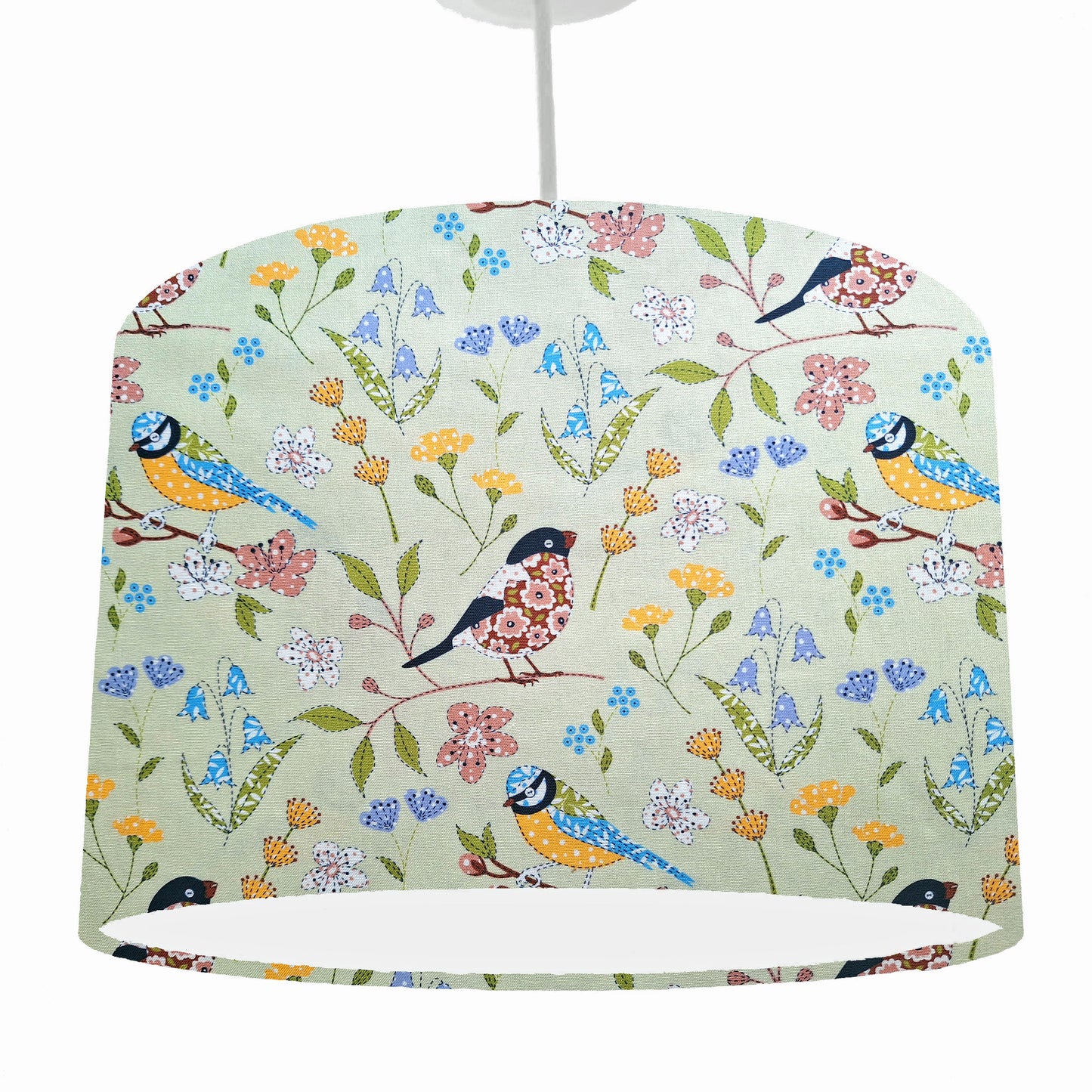Green bird themed ceiling light shade, drum style. Seen as hanging from a ceiling light fixture