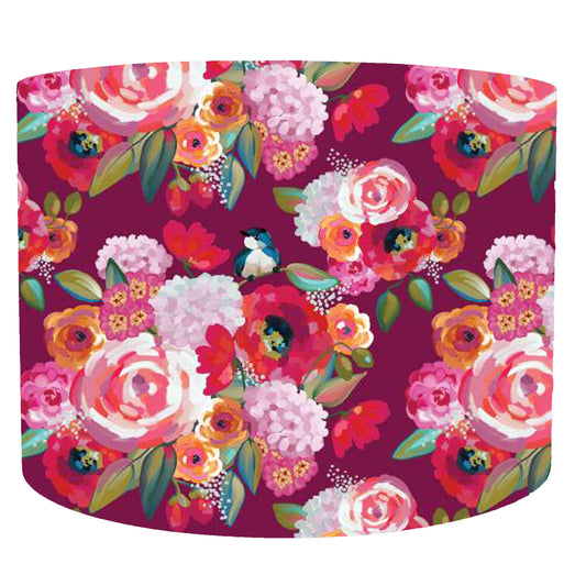 Poppies and birds patterned drum lampshade on a deep burgundy background