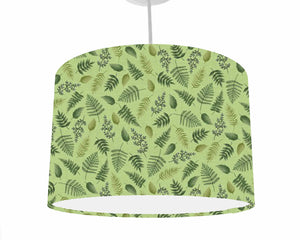 green lampshade with dark green fern leaves